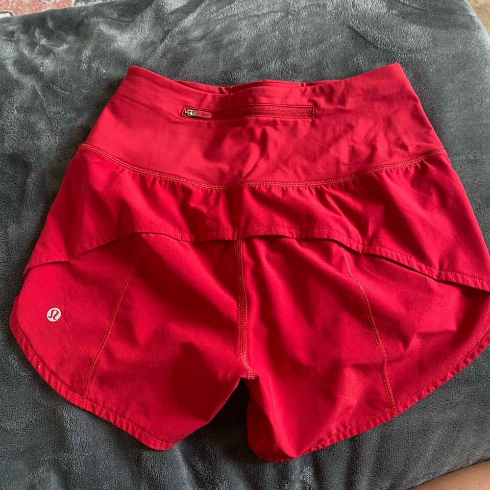 Red Lululemon high rise speed up shorts size 2. 2 inch inseam